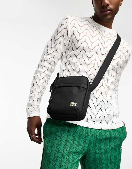 Lacoste logo across body bag in black ASOS