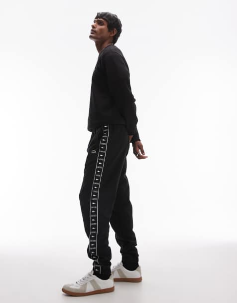 Lacoste logo stripe joggers in black  - view 1