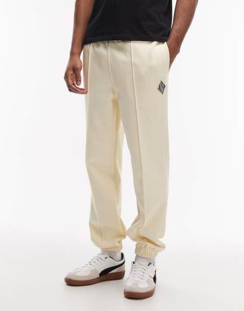 Lacoste logo sweatpants in beige - view 1