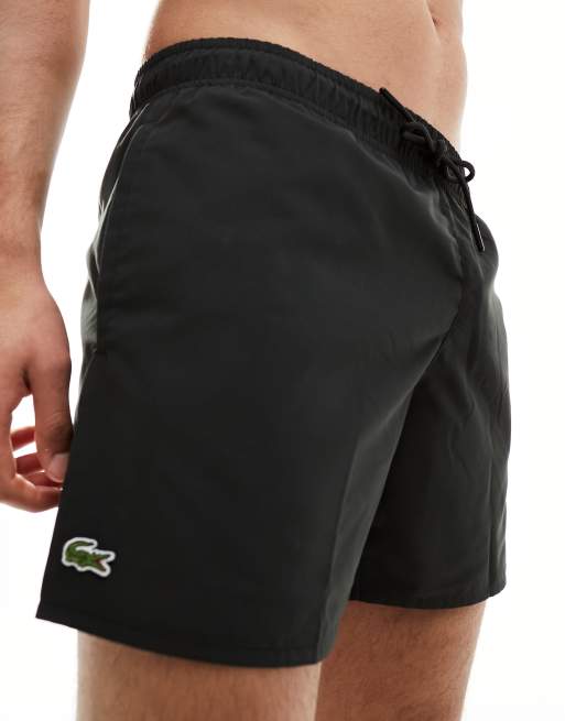 Lacoste logo swim shorts in black ASOS