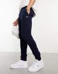 Lacoste logo trackies in navy