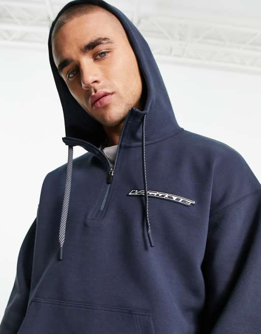 Lacoste loose fit 1/4 zip hoodie in navy with back graphics | ASOS