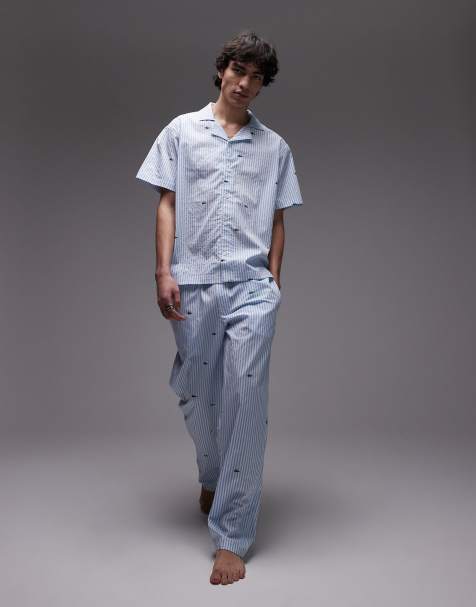 Lacoste loungewear pants in light blue with all-over croc print - view 1