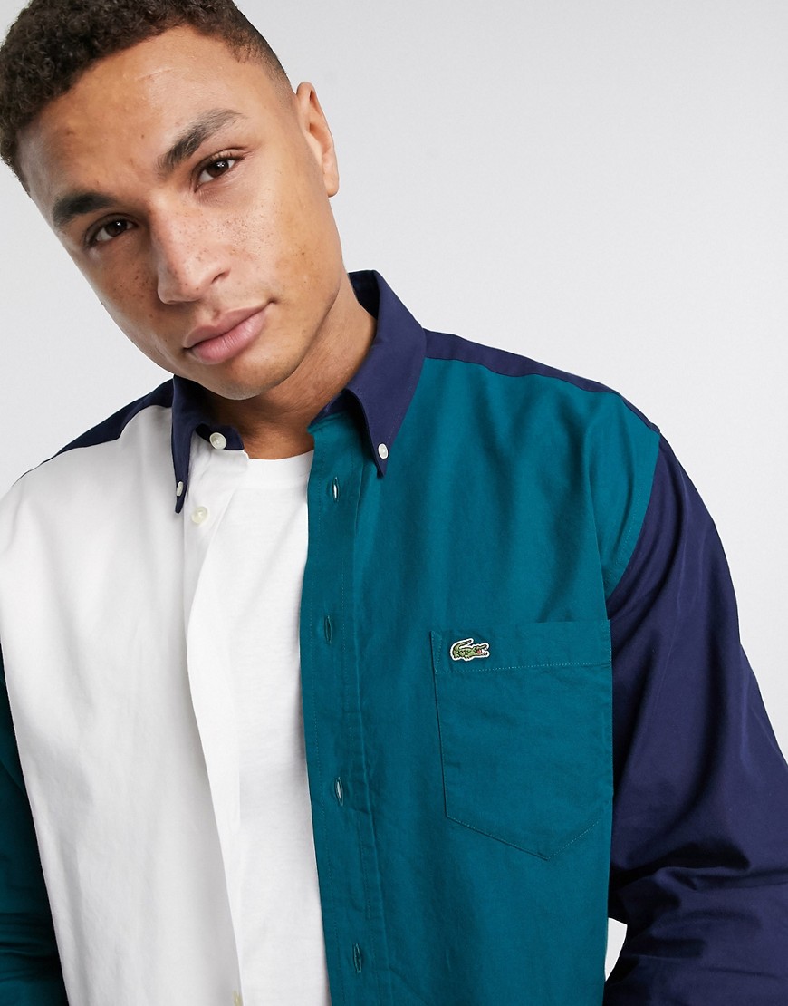 Lacoste – Marinblå blockfärgad oxfordskjorta med avslappnad passform och logga