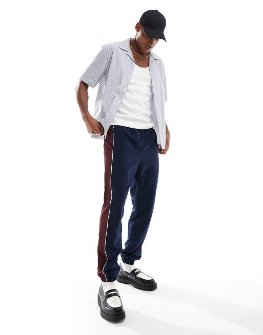 Lacoste – Marinblå blockfärgade sweatpants