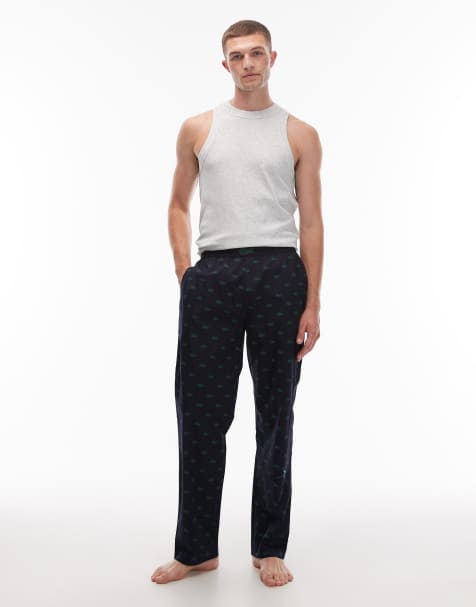 Lacoste – Marinblå pyjamasbyxor med heltäckande krokodilmönster - view 1