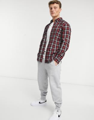 joggers and flannel shirt