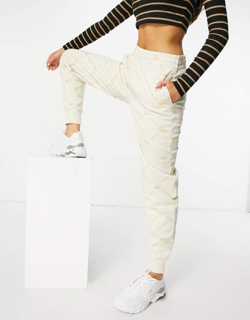 Lacoste monogram logo sweatpants in cream