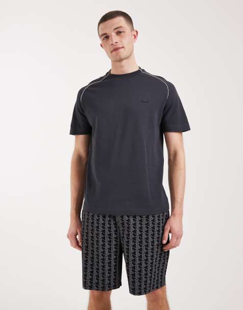 Lacoste monogram print shorts with logo waistband in black - view 1