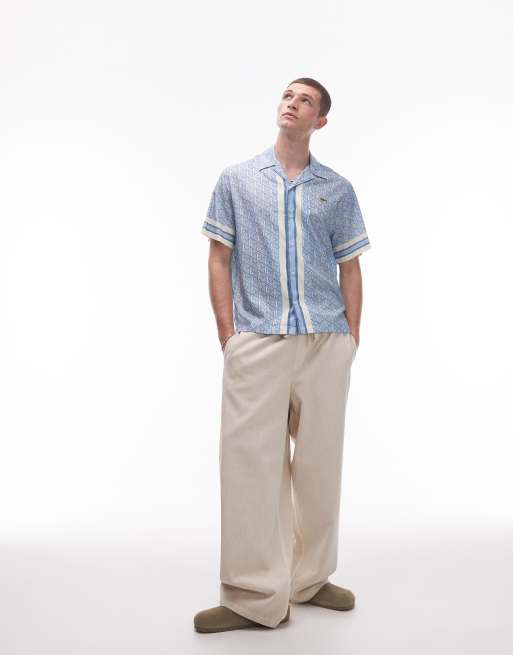 Lacoste - Overhemd met korte mouwen en reverskraag in blauw met witte monogramprint, 3 van 4