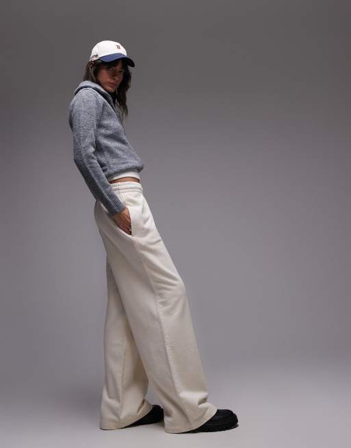 Lacoste - Pantaloni felpati color crema 