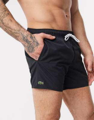 Lacoste plain logo swim shorts in black 