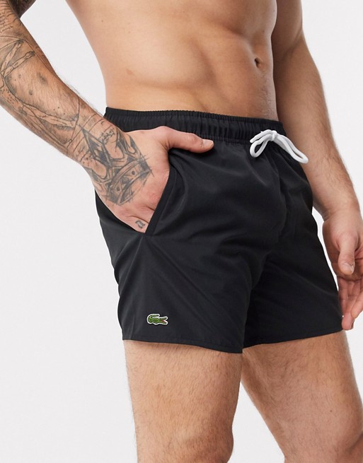 Lacoste plain logo swim shorts in black