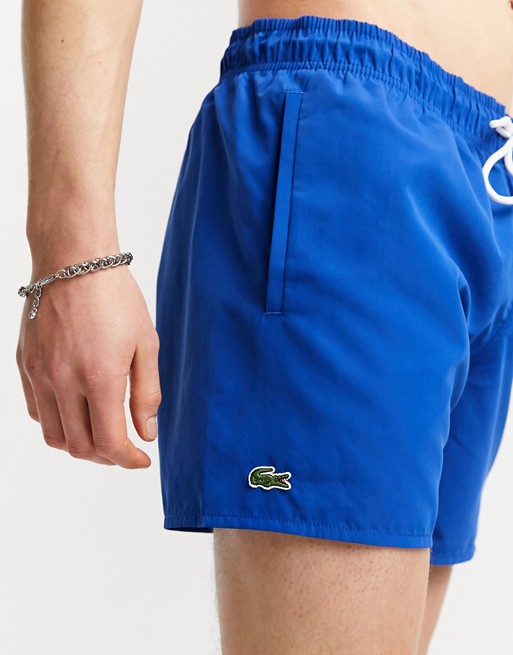 Lacoste plain logo swim shorts in blue