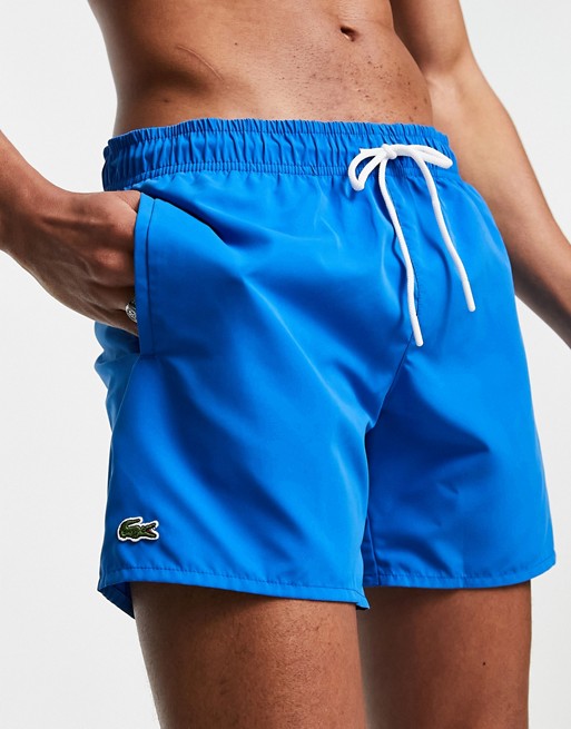 Lacoste plain logo swim shorts in light blue