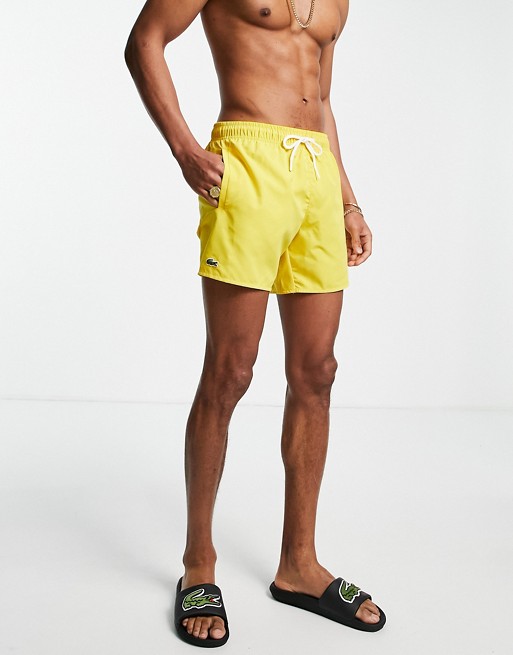 Lacoste plain logo swim shorts in yellow