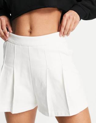 Lacoste pleated tennis skort in cream 