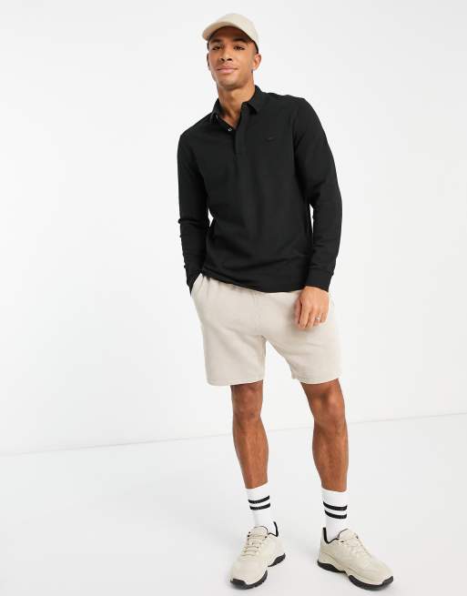 Polo lacoste noir online manche longue