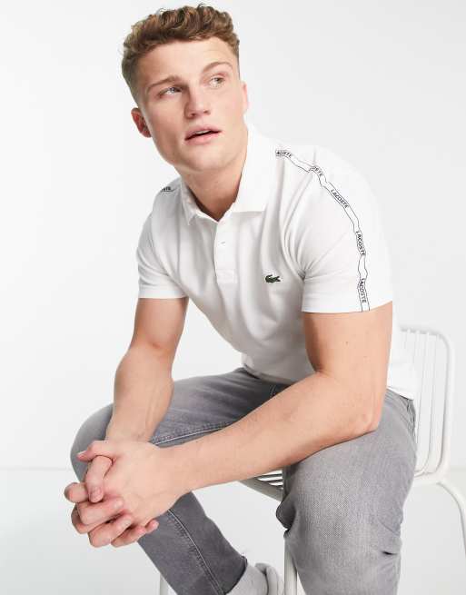 Lacoste - Polo con fettuccia sulle maniche, colore bianco 