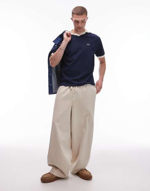 Lacoste polo shirt in navy blue with contrast collar and sleeve taping, 3 of 4