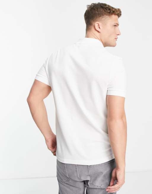Lacoste – Polohemd aus Pikee in Weiß mit großem Logoprint, 3 von 4