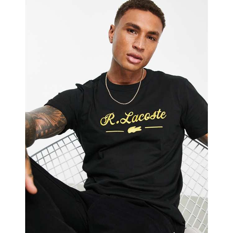 Black and gold lacoste 2024 shirt