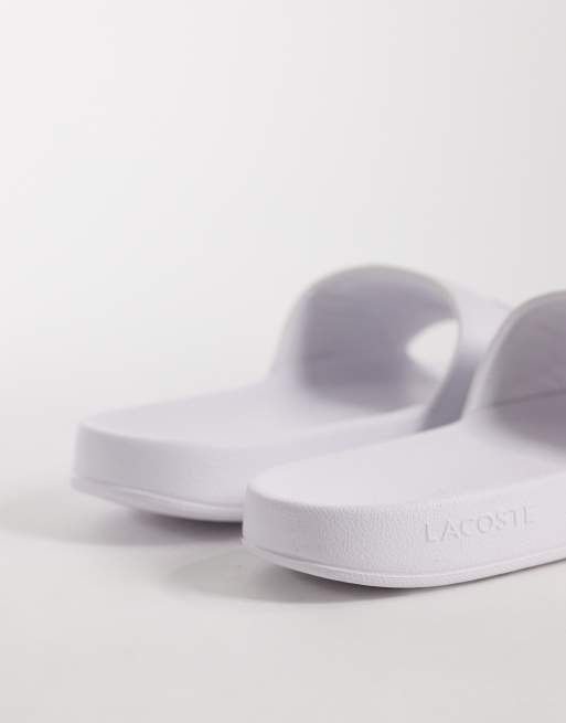 Lacoste Serve 0.0 logo sliders in white, 2 of 4