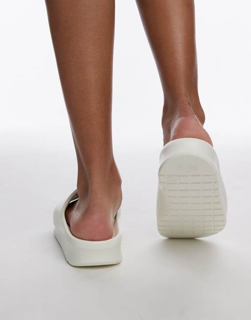 Lacoste Serve 2.0 sliders in off white ASOS