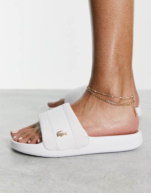 Lacoste Serve Gold Pin sliders in white ASOS