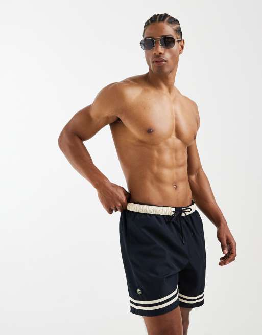 Lacoste - Shorts de baño negros y crudo con rayas en contraste, 5 de 5