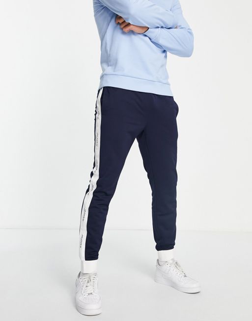 Lacoste side panel trackies in navy white | ASOS