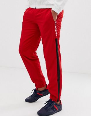 red lacoste tracksuit bottoms