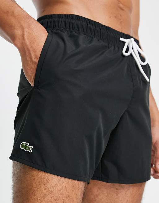 Lacoste small logo swim shorts in black | ASOS