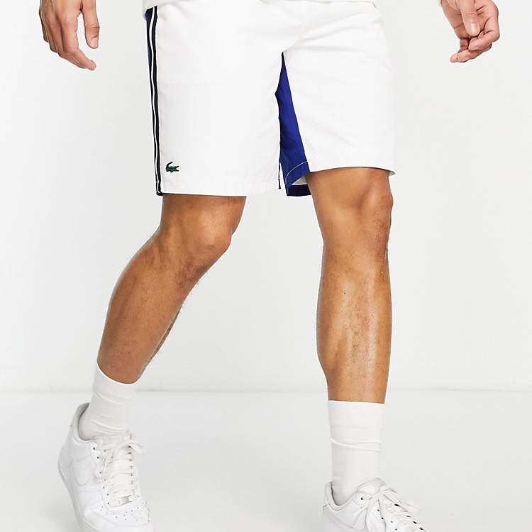 Lacoste Sport shorts with blue paneling in white | ASOS