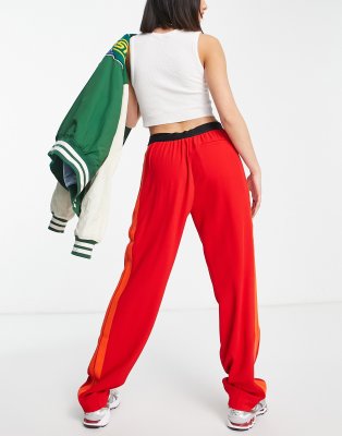 red lacoste guppy pants