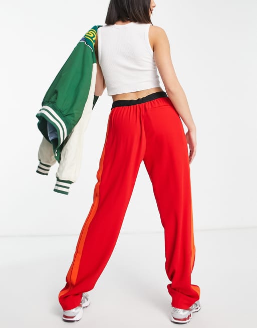 Red lacoste guppy pants sale