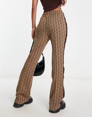 Lacoste straight fit drawstring trousers in brown with all over print