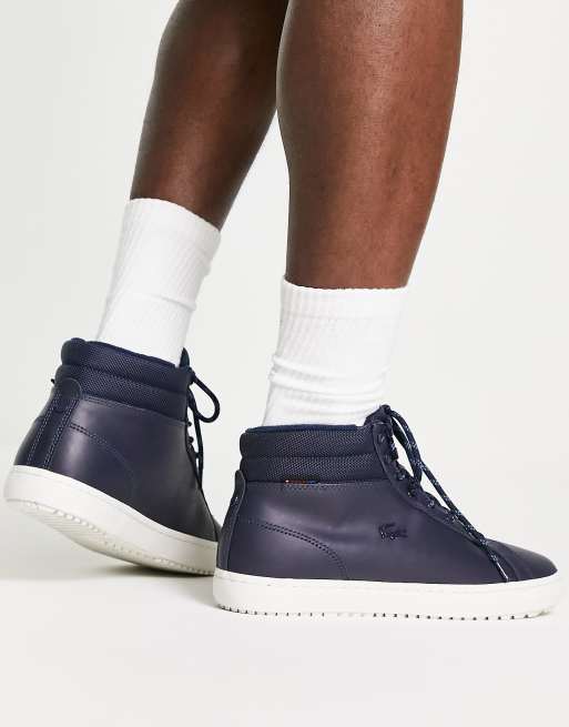 Lacoste hi top sneakers in navy/off