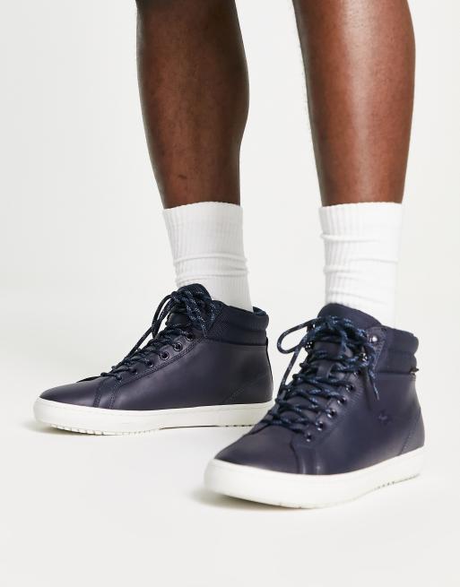 Lacoste hi top sneakers in navy/off