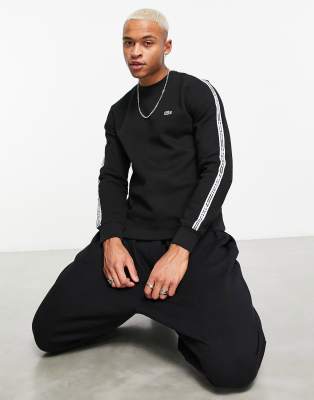 Lacoste - Sweat avec bande ?� logo - Noir | ASOS