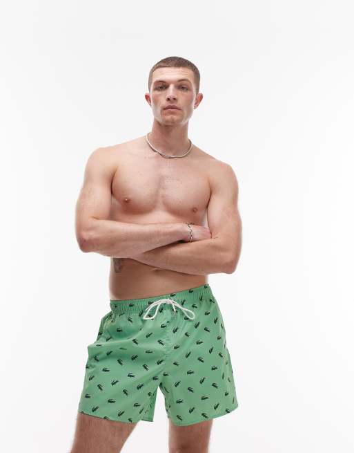 Lacoste swim shorts in green with all-over crocodile print