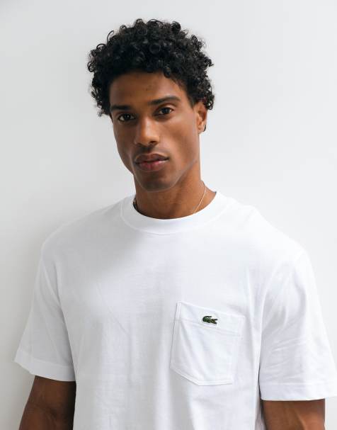 Lacoste - T-shirt bianca a maniche corte con tasca e logo - view 1