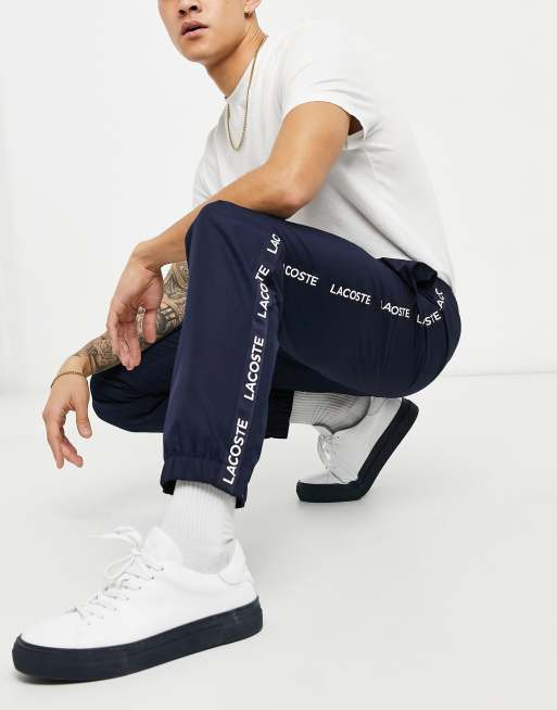 Lacoste tape detail joggers in navy ASOS