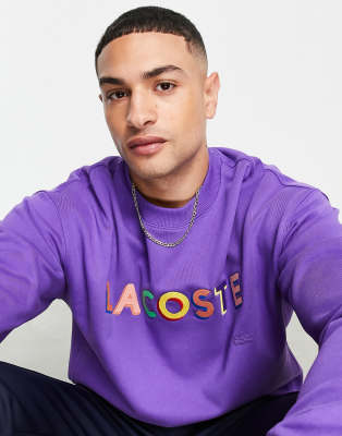 Lacoste text logo crew neck sweatshirt in purple