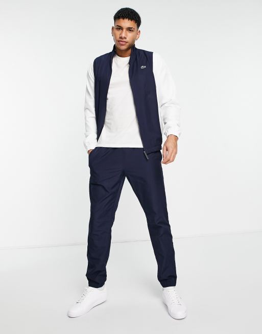 Lacoste tracksuit with taped logo detail in navy white