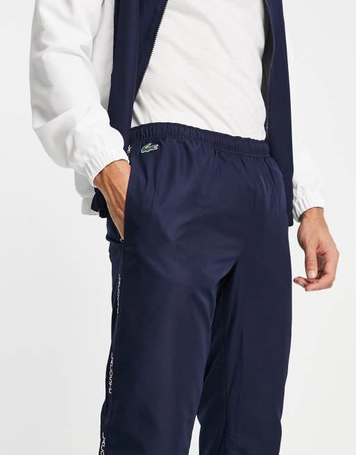 Lacoste tracksuit with taped logo detail in navy white ASOS