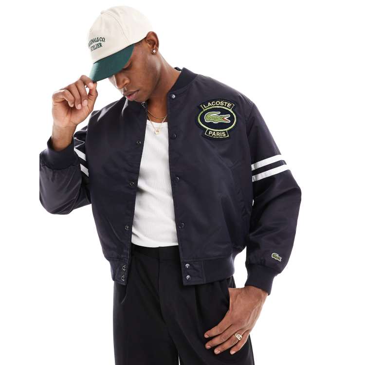 Lacoste – Unisex-College-Jacke in Schwarz mit Logo ASOS