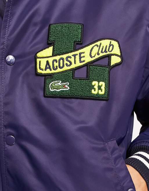 Lacoste - Varsity jack in marineblauw met patches en print op de achterkant, 3 van 4