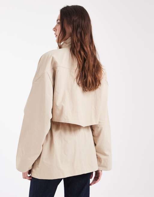 Lacoste water resistant mid length parka jacket in beige , 2 of 4