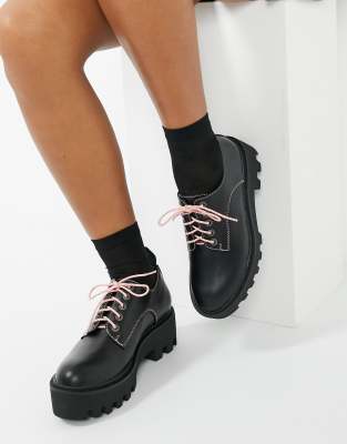 black shoes with pink laces